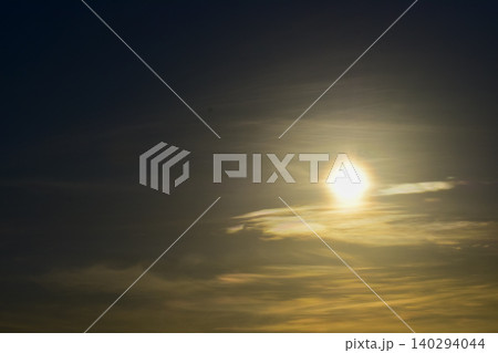 Dramatic skyscape and cloudscape with the bright sun and sunlight. Looking up to the sky. Focus on the sun. Nature scene. 140294044