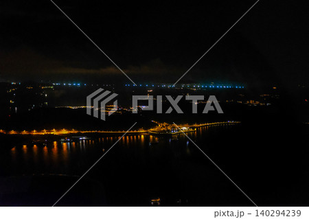 The view of Hong Kong seascape from airplane window. Hong Kong scene from above. Travel and landscape concept. The view of Hong Kong seascape from airplane window. Hong Kong scene from above. Travel and landscape concept. 140294239