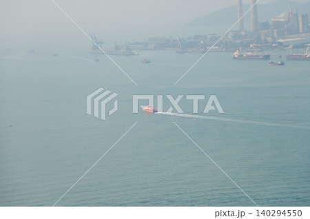 Looking from the airplane window with Hong Kong cityscape. The view of Hong Kong city, Hong Kong landscape from the above. Landscape, travel concept and nature scene. Looking from the airplane window with Hong Kong cityscape. The view of Hong Kong city, Hong Kong landscape from the above. Landscape, travel concept and nature scene. 140294550