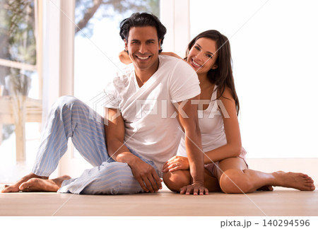 Mexican couple, portrait and bonding and smiling, indoor and sunset for home in living room. Husband, wife and embrace for love, confident and new house on wooden floor for marriage and happiness 140294596