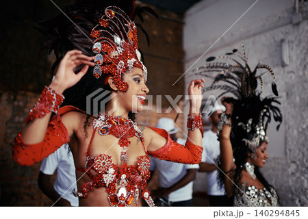 Smile, dance and women at carnival in costume for celebration, music culture and happy band in Brazil. Samba, party and girl friends together at festival, parade or stage show in Rio de Janeiro. 140294845