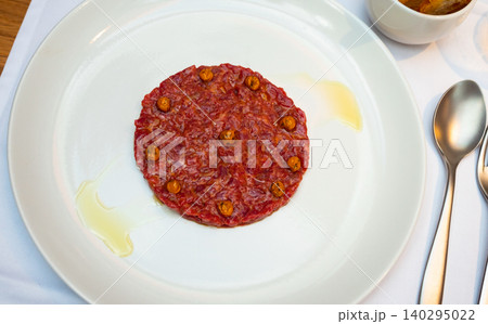 Beef tartare with rich yolk sauce and crusty toasts Beef tartare with rich yolk sauce and crusty toasts 140295022