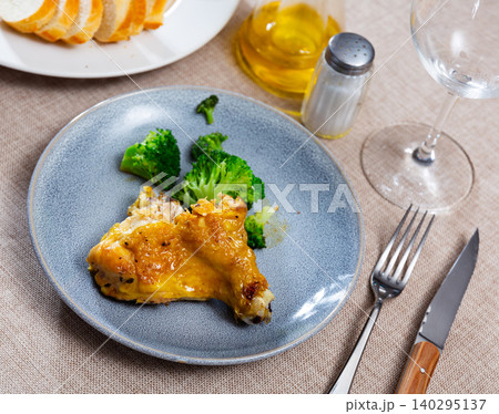 Fried chicken fillet served on plate with tasty broccoli. Hearty healthy lunch 140295137