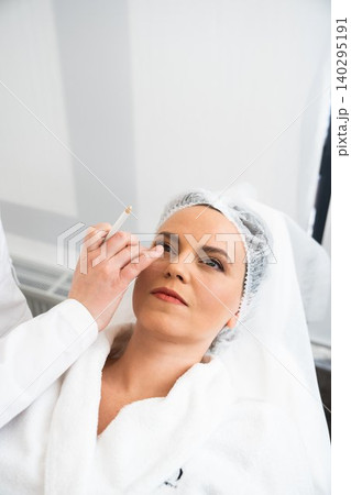 Woman receiving cosmetic treatment in a spa during daytime 140295191