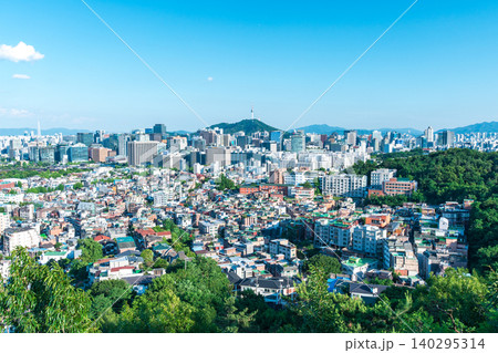 Panoramic view of downtown Seoul city skyline and Namsan Seoul Tower from Inwangsan Mountain on a clear summer day Panoramic view of downtown Seoul city skyline and Namsan Seoul Tower from Inwangsan Mountain on a clear summer day 140295314
