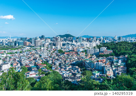 Panoramic view of downtown Seoul city skyline and Namsan Seoul Tower from Inwangsan Mountain on a clear summer day Panoramic view of downtown Seoul city skyline and Namsan Seoul Tower from Inwangsan Mountain on a clear summer day 140295319