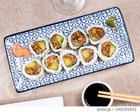 Sake Cooked Roll with baked salmon, avocado, and fried onion Sake Cooked Roll with baked salmon, avocado, and fried onion 140295452