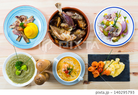Dishes of traditional Norwegian cuisine with lamb rib, seafood and vegetables 140295793