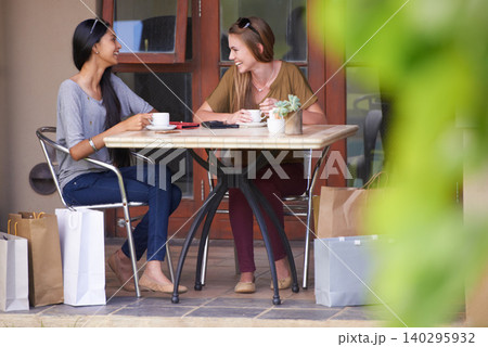 Friends, cafe and shopping bag with fashion, sale and discount in a happy conversation, talking or chat. Young people, women or customer at coffee shop in Europe and happy for holiday or outdoor Friends, cafe and shopping bag with fashion, sale and discount in a happy conversation, talking or chat. Young people, women or customer at coffee shop in Europe and happy for holiday or outdoor 140295932
