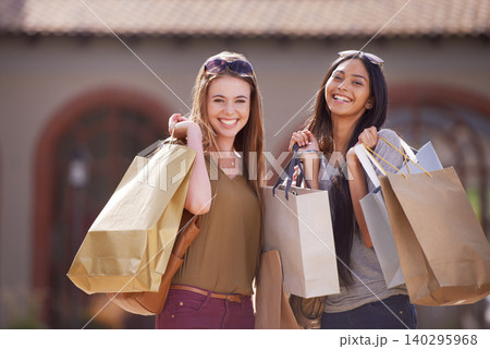 Women, friends and shopping bag for outdoor fashion with sale, discount and a happy portrait. Face of young people with smile, diversity and cool clothes, accessories or sunglasses in city for retail 140295968