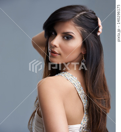 Fashion, beauty and portrait of woman in studio with confidence, glamour and luxury style. Attractive, aesthetic and person with stylish clothes, cosmetics and designer outfit on gray background 140296175