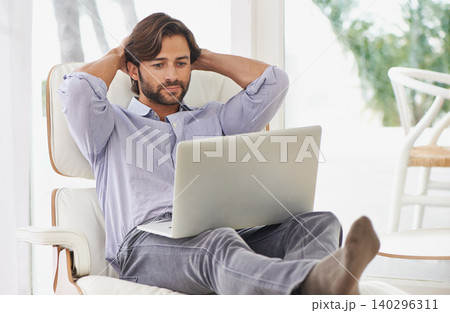 Businessman, relax and couch with laptop online for remote work, living room and home office for freelance job. Male person, social media and browsing or research on computer, sofa and smile Businessman, relax and couch with laptop online for remote work, living room and home office for freelance job. Male person, social media and browsing or research on computer, sofa and smile 140296311