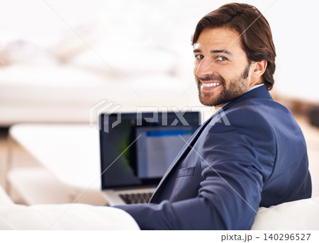 Happy, portrait and businessman with remote work on sofa with laptop in home or living room. Entrepreneur, smile and working in lounge with computer for online research, report or journalist writing 140296527