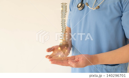 Doctor hands holding anatomy of spine for diagnosis and treatment. Awareness of herniated discs, scoliosis, and spinal stenosis. Orthopedic concept. Doctor hands holding anatomy of spine for diagnosis and treatment. Awareness of herniated discs, scoliosis, and spinal stenosis. Orthopedic concept. 140296701