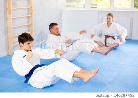 Athlete before martial match performs exercises to strengthen press and improve accuracy of hands 140297458
