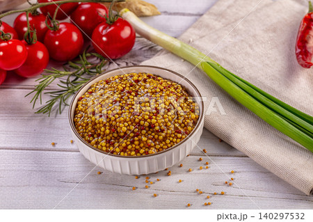 Whole Grain Mustard in Bowl with Fresh Cherry Tomatoes, Green Onion, Rosemary 140297532