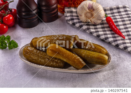 Pickled Cucumbers Plate with Fresh Tomatoes, Garlic, Chili, Parsley, Rustic Setting 140297541