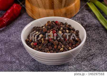 Mixed Peppercorns Variety in White Bowl. Black, white, red, green spice blend Mixed Peppercorns Variety in White Bowl. Black, white, red, green spice blend 140297568