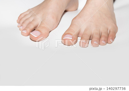Female feet with neat pedicure and copyspace 140297736