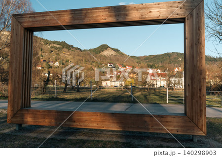 Wooden Viewing Frame With Mountain Village Landscape Wooden Viewing Frame With Mountain Village Landscape 140298903