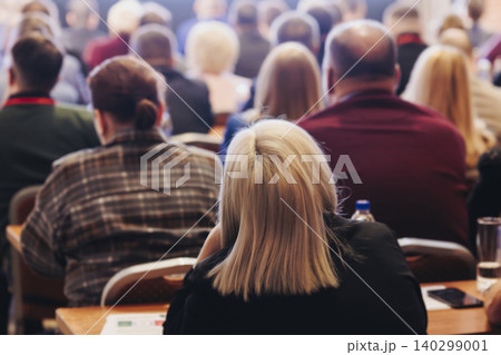 Conference, hall with audience, panel discussion at forum, people on a congress together listen to speaker on stage at convention, plenary session at business lecture seminar, venue for presentation Conference, hall with audience, panel discussion at forum, people on a congress together listen to speaker on stage at convention, plenary session at business lecture seminar, venue for presentation 140299001