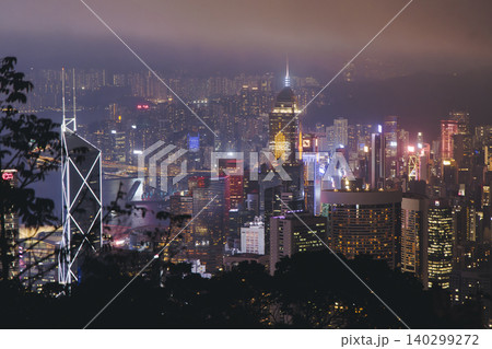 Hong Kong night evening view, China, seen from Victoria Peak observation deck, Lugard road lookout, with Hong Kong downtown skyscrapers and Kowloon island, illuminated city and Victoria Bay at night 140299272