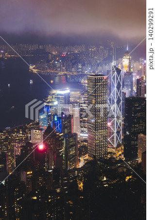 Hong Kong night evening view, China, seen from Victoria Peak observation deck, Lugard road lookout, with Hong Kong downtown skyscrapers and Kowloon island, illuminated city and Victoria Bay at night 140299291