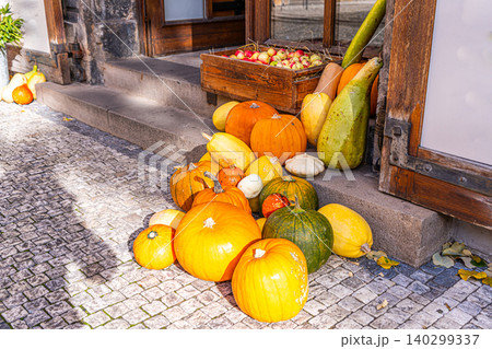 Set different pumpkins on the doorstep. Halloween and Thanksgiving decorations. Fall decor 140299337