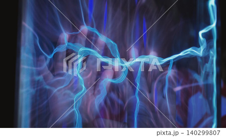 Hand glowing with electric plasma energy inside glass tube, abstract science concept Hand glowing with electric plasma energy inside glass tube, abstract science concept 140299807
