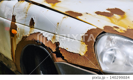 Rust corrosion on white car fender and hood in Moscow showing metal decay Rust corrosion on white car fender and hood in Moscow showing metal decay 140299884