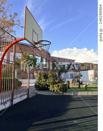 A photograph of a street basketball court. Streetball or street basketball. Active living and sports concept A photograph of a street basketball court. Streetball or street basketball. Active living and sports concept 140299904