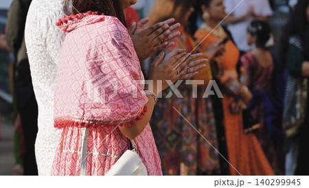 Indian women clapping hands at Ganesh festival, celebrating Hindu culture and devotion Indian women clapping hands at Ganesh festival, celebrating Hindu culture and devotion 140299945