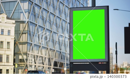 Outdoor city advertising mockup with green screen billboard on urban street Outdoor city advertising mockup with green screen billboard on urban street 140300373