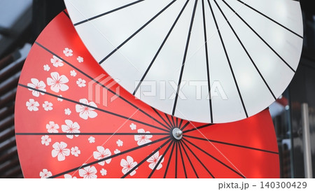 Traditional wagasa umbrellas displaying sakura pattern and minimalist design 140300429