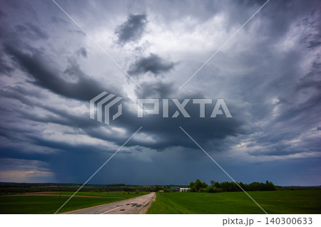 Angry supercell storm influenced by Climate change. Dangerous storm supercell shelf cloud with layers 140300633