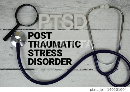 PTSD Post-traumatic Stress Disorder text with Stethoscope on wooden background 140301004