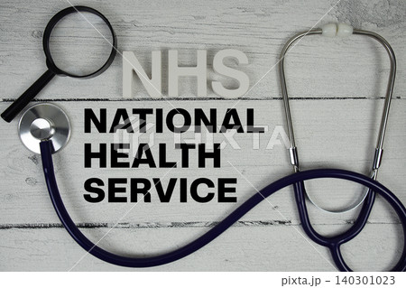 NHS National Health Service text with Stethoscope on wooden background 140301023