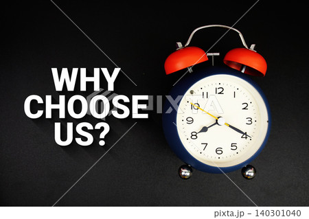 Why Choose Us? text with alarm clock on black background Why Choose Us? text with alarm clock on black background 140301040