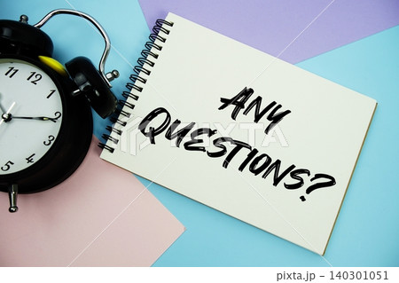 Any Questions text written on notepad with alarm clock flat lay on multicolor pastel background Any Questions text written on notepad with alarm clock flat lay on multicolor pastel background 140301051