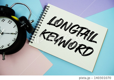 Longtail Keyword text written on notepad with alarm clock flat lay on multicolor pastel background Longtail Keyword text written on notepad with alarm clock flat lay on multicolor pastel background 140301070