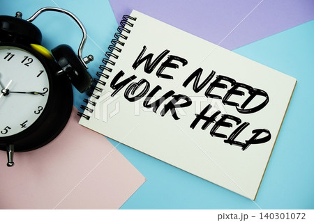 We Need Your Help text written on notepad with alarm clock flat lay on multicolor pastel background We Need Your Help text written on notepad with alarm clock flat lay on multicolor pastel background 140301072