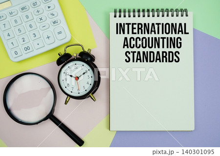 International Accounting Standards text with calculator, alarm clock and magnifying glass International Accounting Standards text with calculator, alarm clock and magnifying glass 140301095
