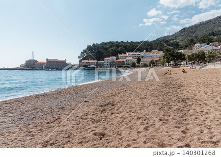 Petrovac, Montenegro, 12 April 2026, People relax on beach, swim Adriatic Sea Petrovac, Montenegro, 12 April 2026, People relax on beach, swim Adriatic Sea 140301268