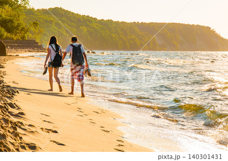 Couple Man And Woman Walk On Sandy Beach Sea Ocean Water pond, Summer Landscape 140301431