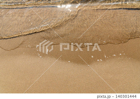 Ocean sea water pond wave covers sandy beach, summer on sunny day outdoor sand Ocean sea water pond wave covers sandy beach, summer on sunny day outdoor sand 140301444