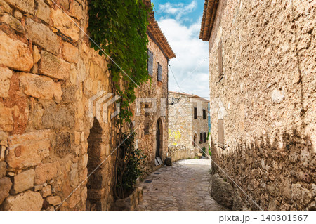 Stone alley with historic limestone houses in medieval Siurana village, Catalonia, Spain Stone alley with historic limestone houses in medieval Siurana village, Catalonia, Spain 140301567