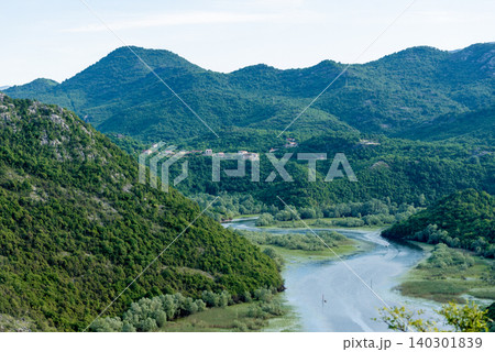 Crnojevica River flows into Lake Skadar, summer mountains Montenegro landscape Crnojevica River flows into Lake Skadar, summer mountains Montenegro landscape 140301839