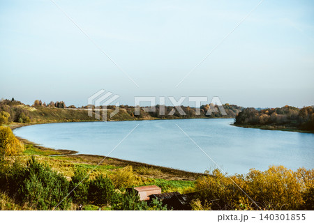 Wide river flows in valley plain on sunny summer day in central Russia Wide river flows in valley plain on sunny summer day in central Russia 140301855