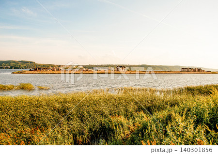 Wide river Volga flows in valley plain on sunny summer day in central Russia 140301856