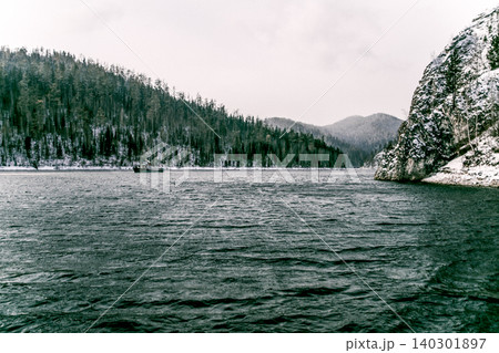 Krasnoyarsk Reservoir on Yenisei River, winter landscape on cloudy day Siberia Krasnoyarsk Reservoir on Yenisei River, winter landscape on cloudy day Siberia 140301897